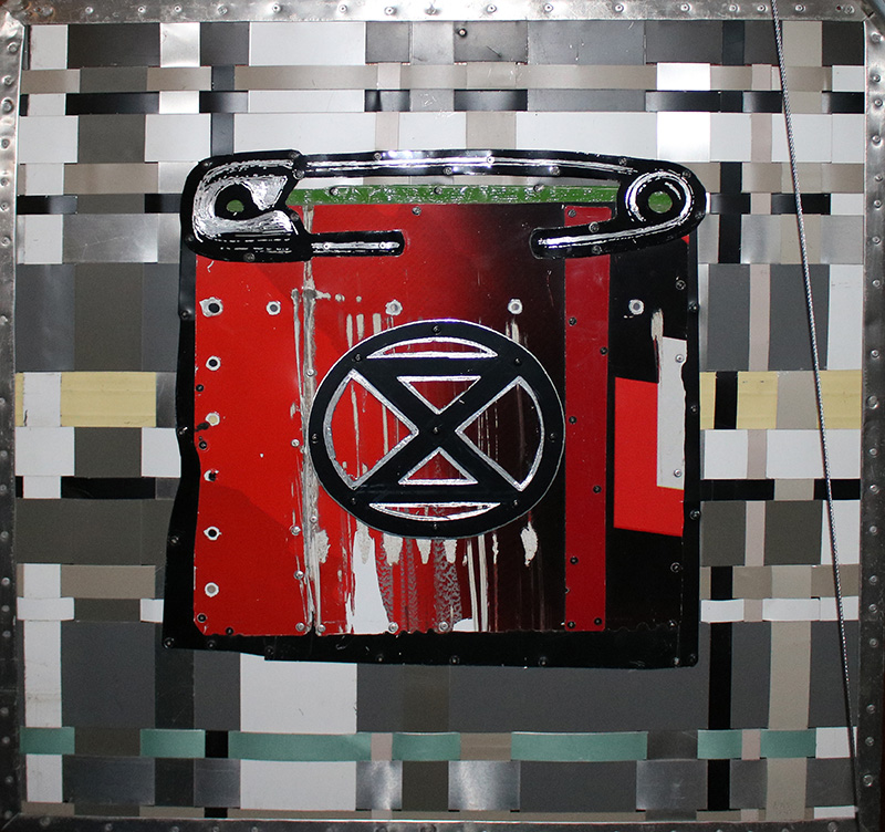 Extinction Rebellion Patch by Dave Hind - quilted aluminum